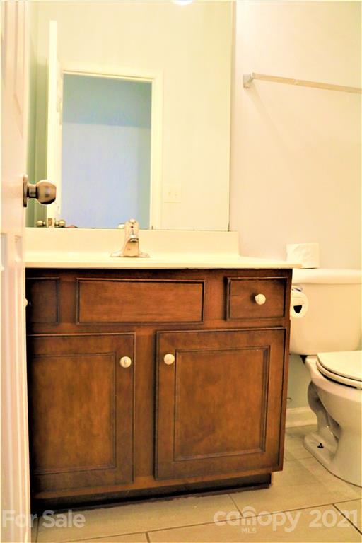 3234 Queensland Court Indian Land, SC 29707 - Photo 26 of 35 a bathroom with a sink a toilet and mirror