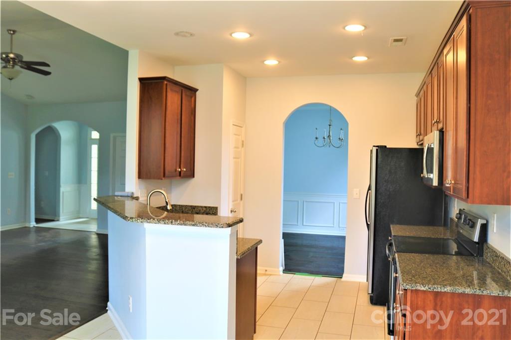 3234 Queensland Court Indian Land, SC 29707 - Photo 8 of 35 a bathroom with a double vanity sink and mirror