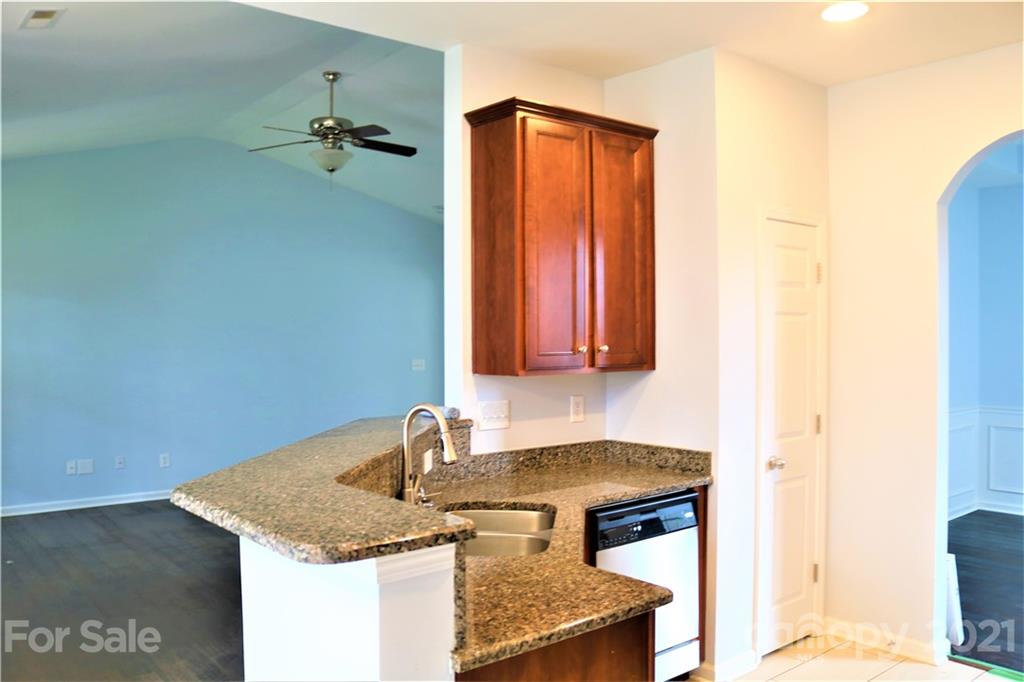 3234 Queensland Court Indian Land, SC 29707 - Photo 10 of 35 a bathroom with a granite countertop sink and a mirror