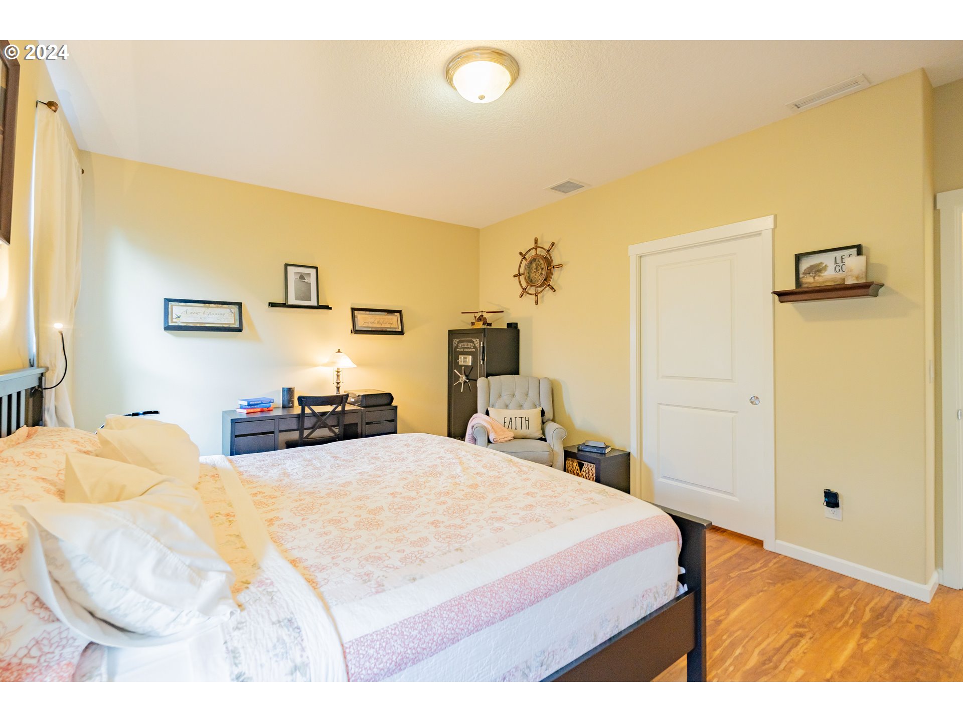 331 North 35th Avenue Ridgefield, WA 98642 - Photo 18 of 39 a bedroom with a bed and a lamp