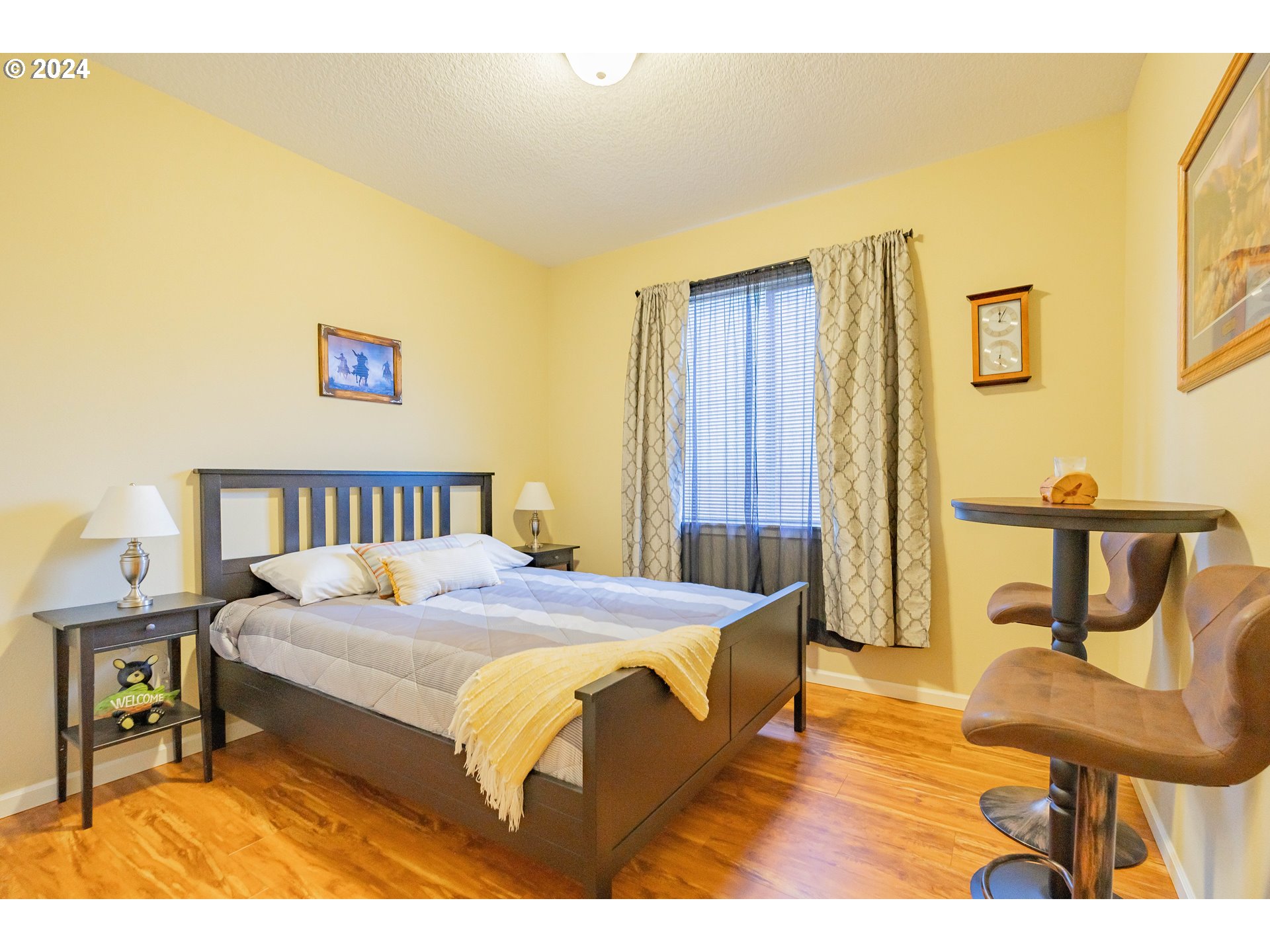 331 North 35th Avenue Ridgefield, WA 98642 - Photo 22 of 39 a bedroom with a bed and a table in it