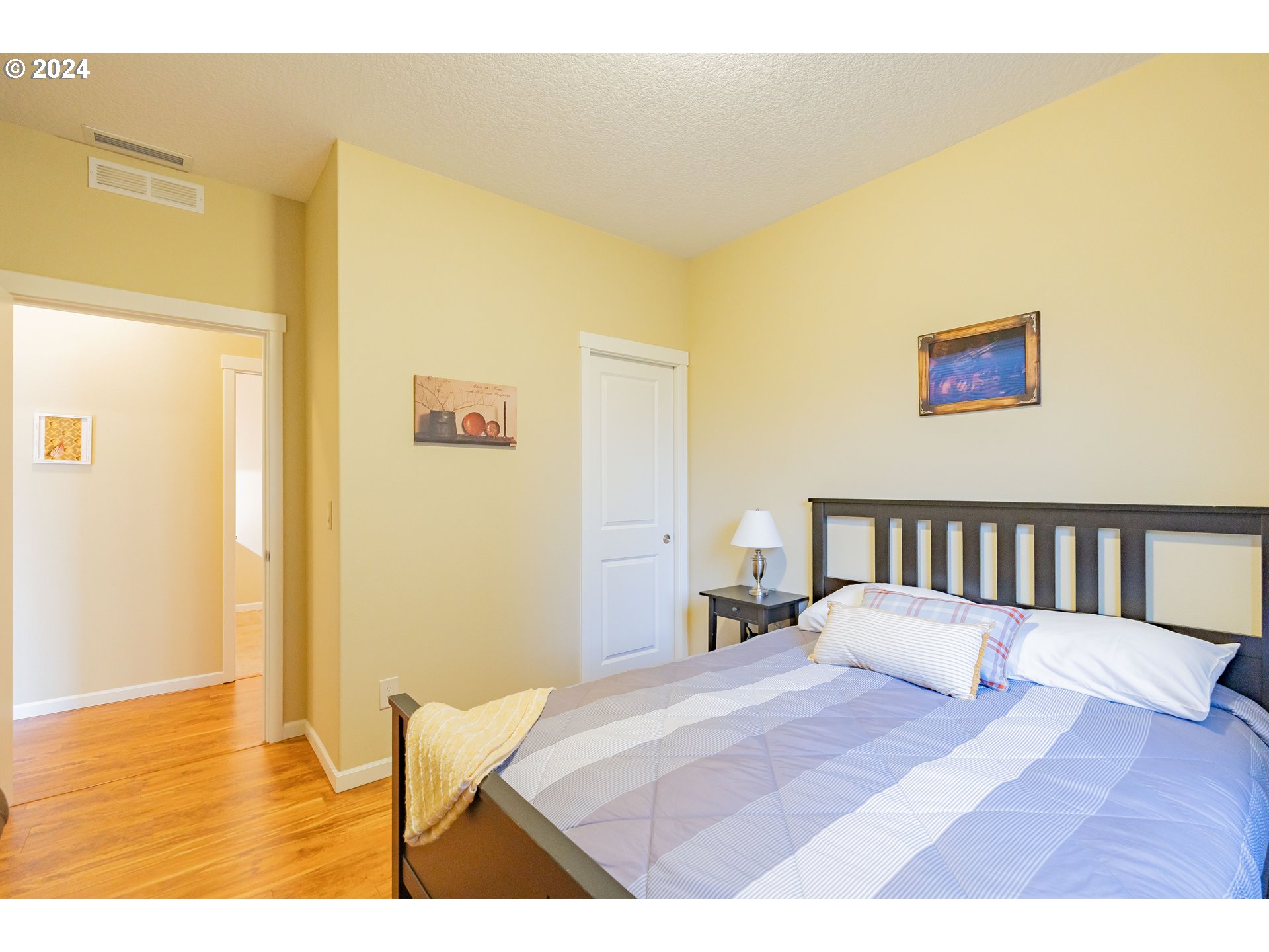 331 North 35th Avenue Ridgefield, WA 98642 - Photo 23 of 39 a bedroom with a bed and a painting on the wall