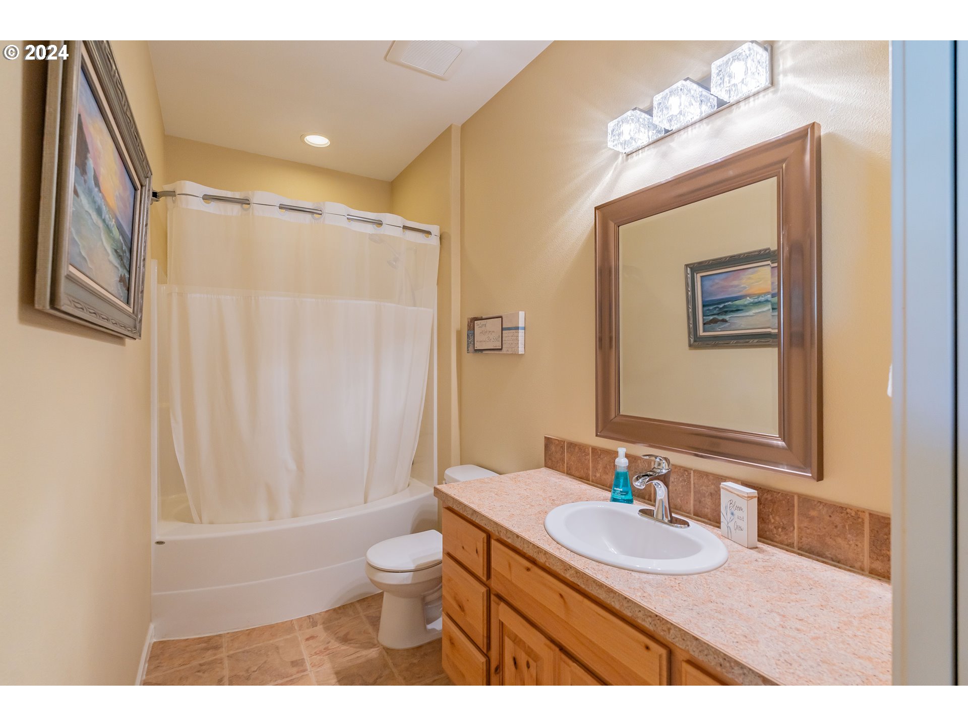 331 North 35th Avenue Ridgefield, WA 98642 - Photo 24 of 39 a bathroom with a granite countertop sink toilet and shower