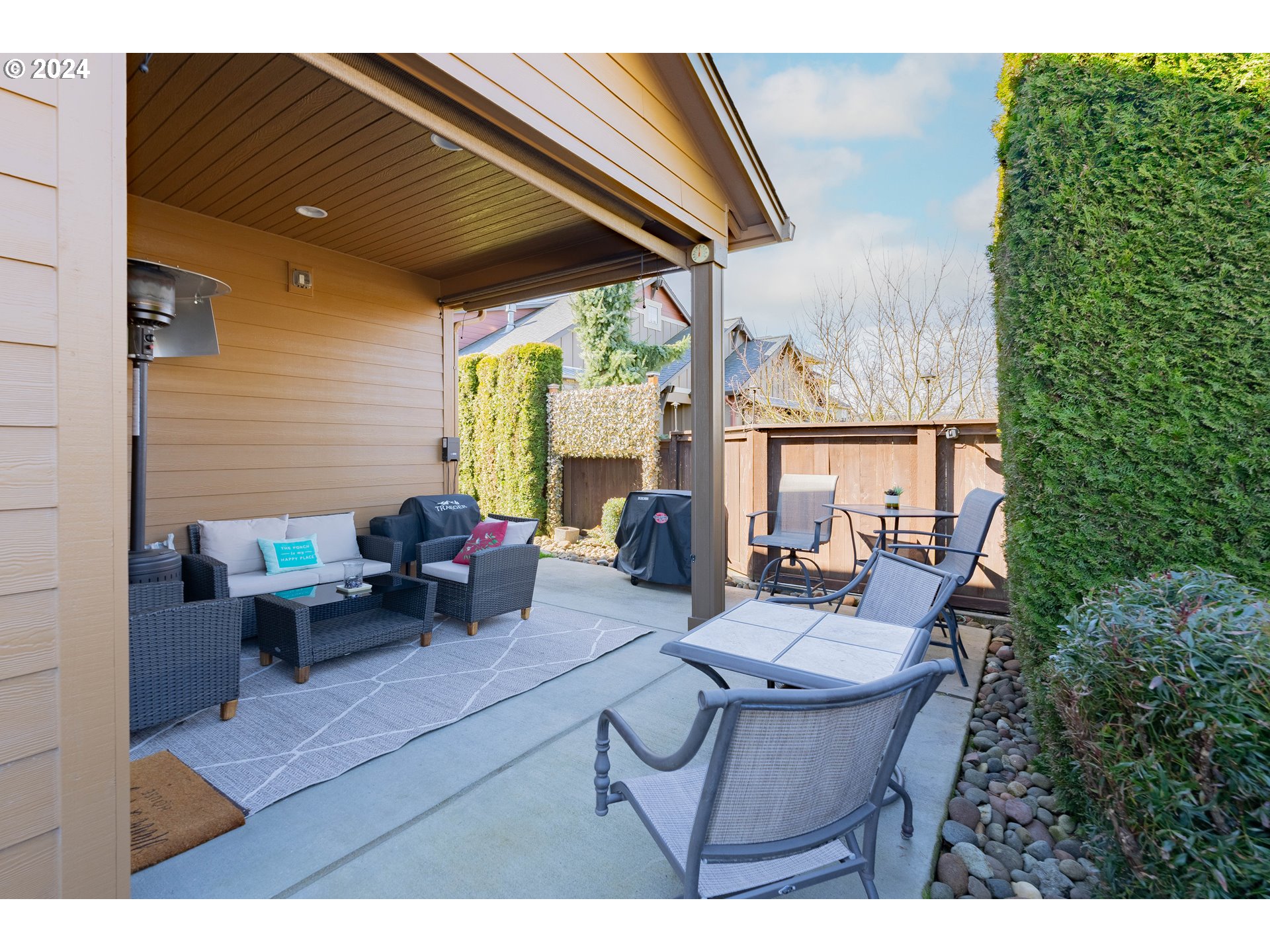 331 North 35th Avenue Ridgefield, WA 98642 - Photo 34 of 39 a view of a patio with table and chairs and potted plants