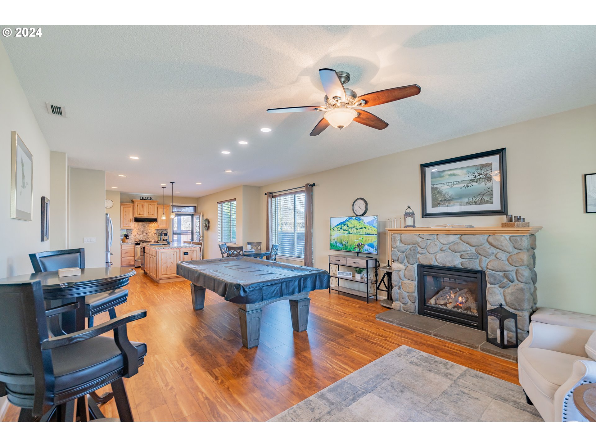 331 North 35th Avenue Ridgefield, WA 98642 - Photo 7 of 39 a living room with furniture and a fireplace