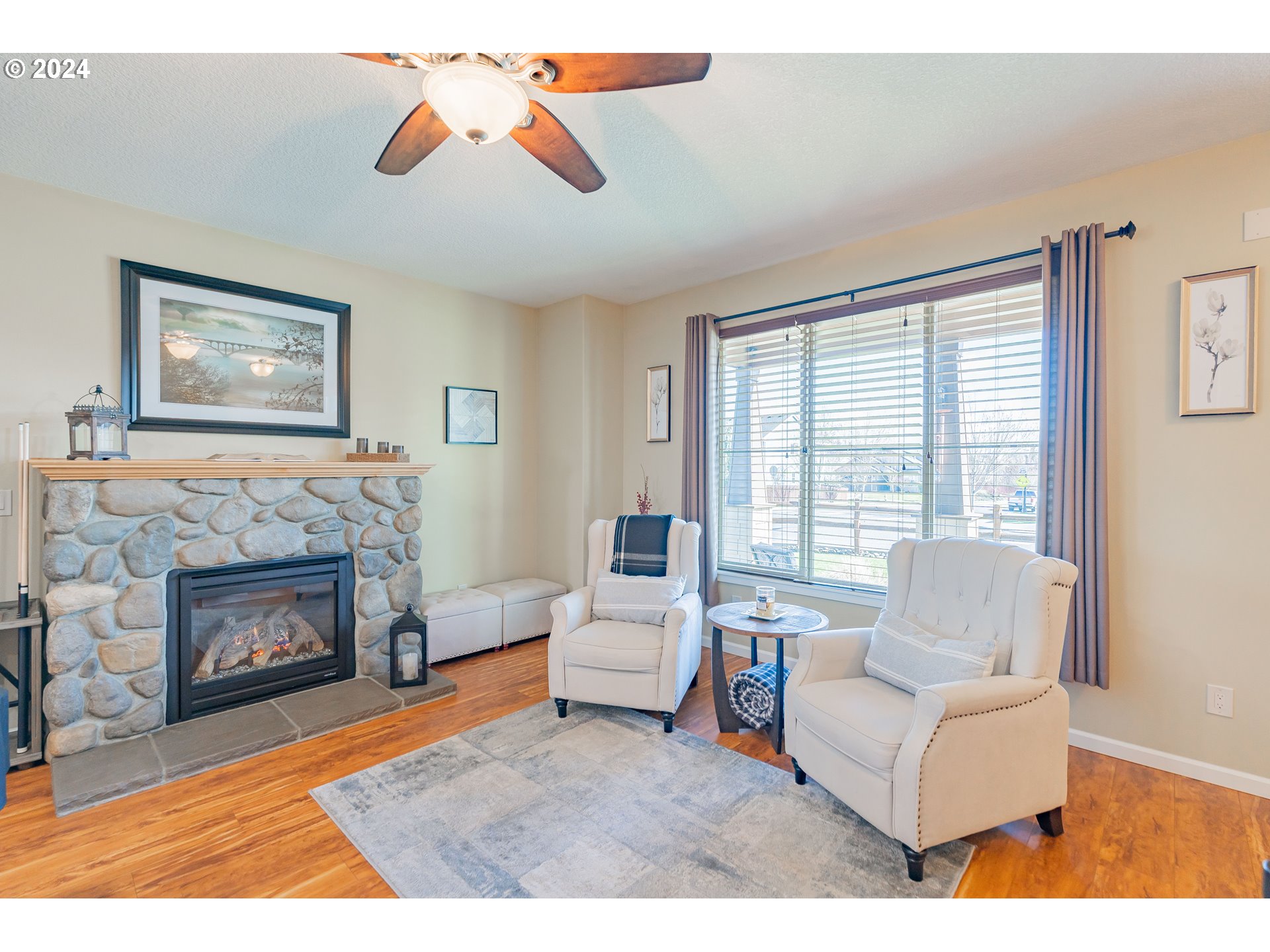 331 North 35th Avenue Ridgefield, WA 98642 - Photo 8 of 39 a living room with furniture and a fireplace