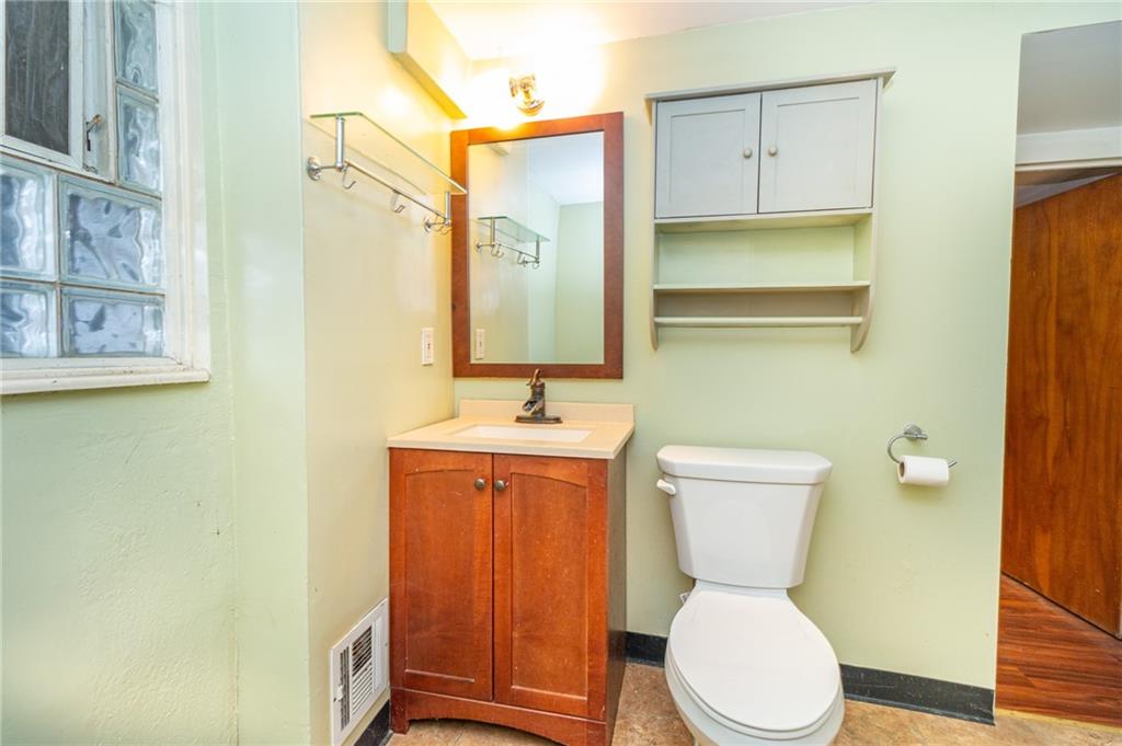 70 South 11th Street Pittsburgh, PA 15203 - Photo 11 of 31 a white toilet sitting next to a bathroom sink