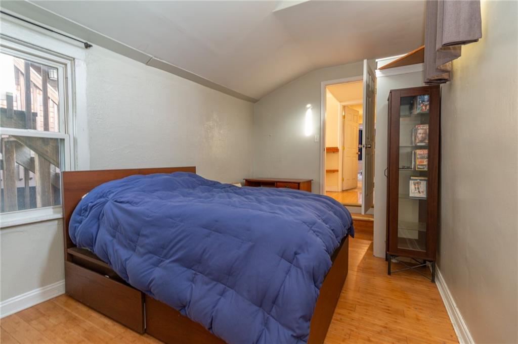 70 South 11th Street Pittsburgh, PA 15203 - Photo 18 of 31 a bedroom with a bed and closet