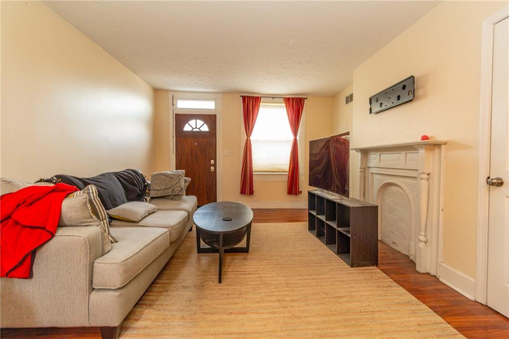 70 South 11th Street Pittsburgh, PA 15203 - Photo 3 of 31 a living room with furniture and a fireplace