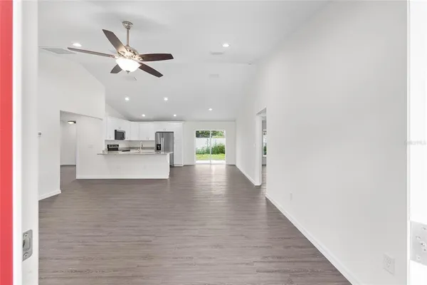 a view of kitchen with cabinets and wooden floor