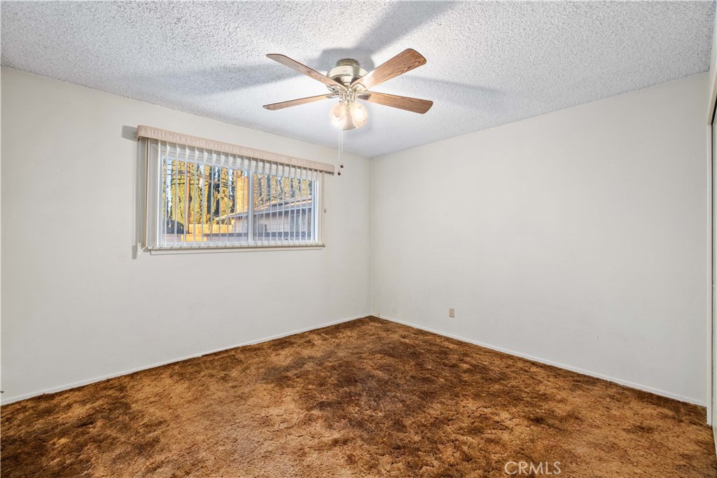 5011 East Ave R 12 Palmdale, CA 93552 - Photo 16 of 25 wooden floor in an empty room with a window