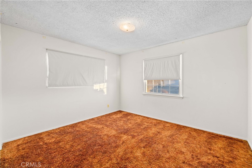 5011 East Ave R 12 Palmdale, CA 93552 - Photo 17 of 25 an empty room with a window