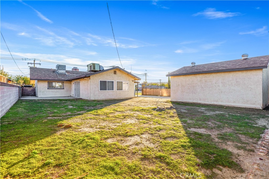 5011 East Ave R 12 Palmdale, CA 93552 - Photo 20 of 25 a view of a house with a yard
