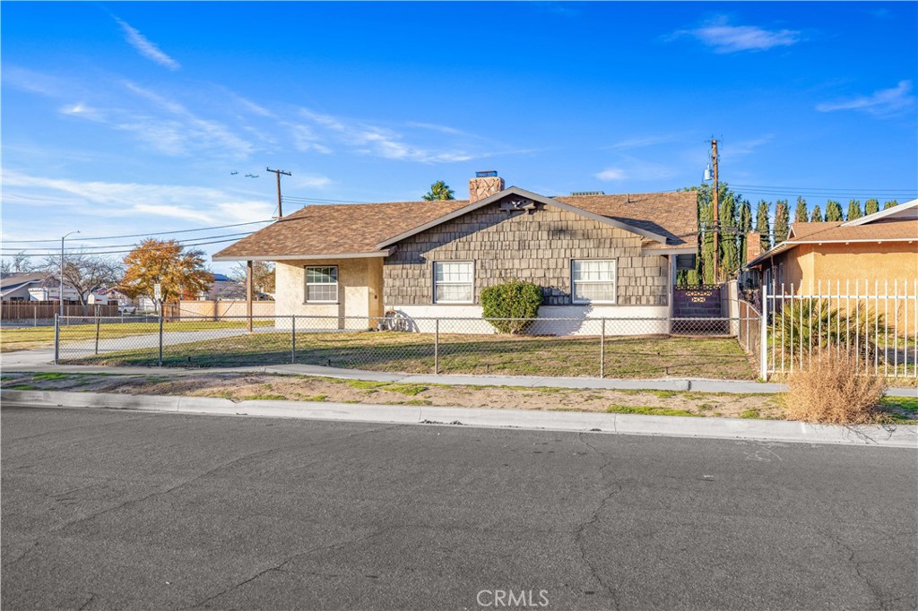 5011 East Ave R 12 Palmdale, CA 93552 - Photo 2 of 25 a view of a house with a swimming pool