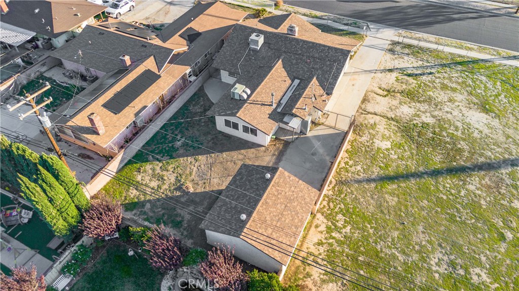 5011 East Ave R 12 Palmdale, CA 93552 - Photo 24 of 25 an aerial view of a house with a yard and potted plants