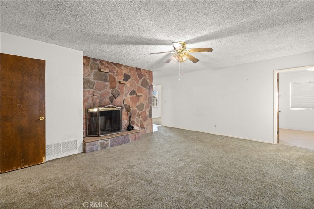 5011 East Ave R 12 Palmdale, CA 93552 - Photo 5 of 25 a view of empty room with a fireplace