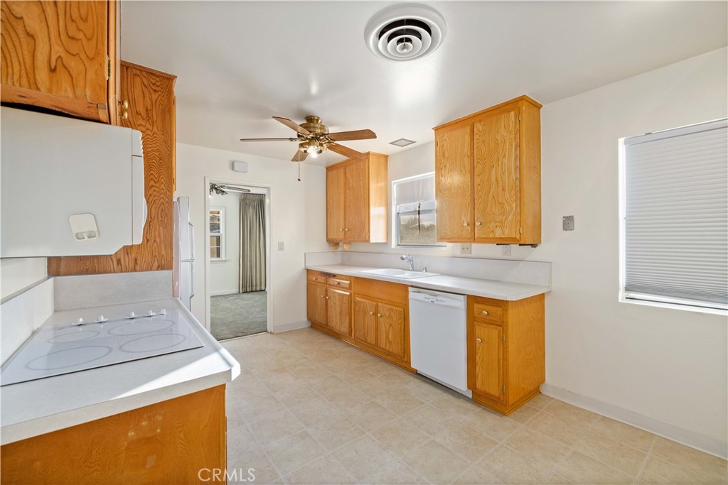5011 East Ave R 12 Palmdale, CA 93552 - Photo 9 of 25 a large bathroom with a granite countertop sink and a mirror