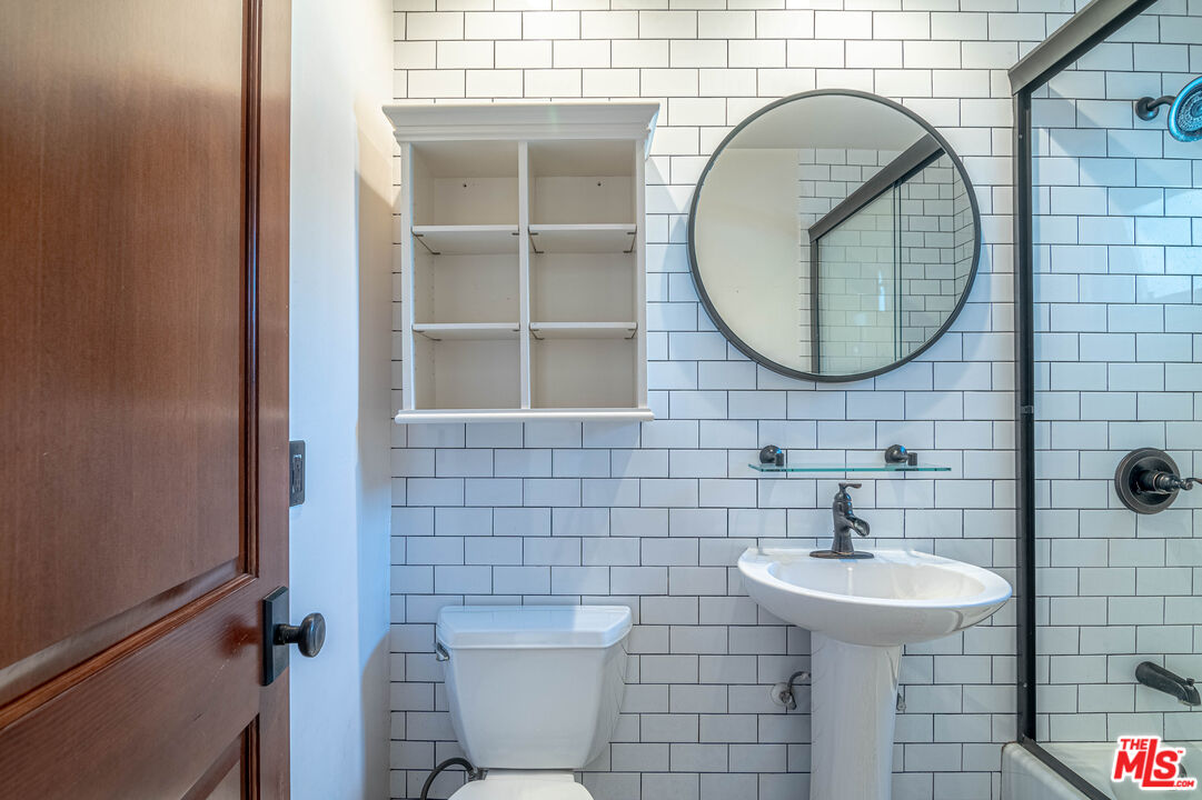 2504 Ocean Avenue Venice, CA 90291 - Photo 14 of 26 a bathroom with a sink and a mirror