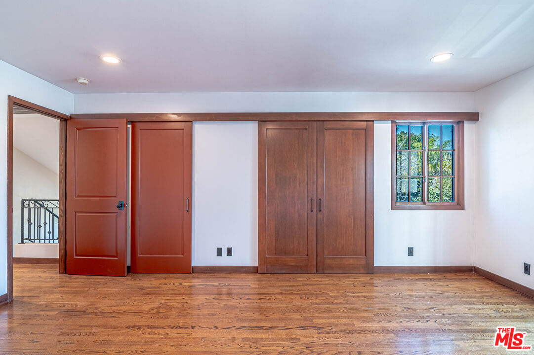 2504 Ocean Avenue Venice, CA 90291 - Photo 15 of 26 an empty room with wooden floor and windows