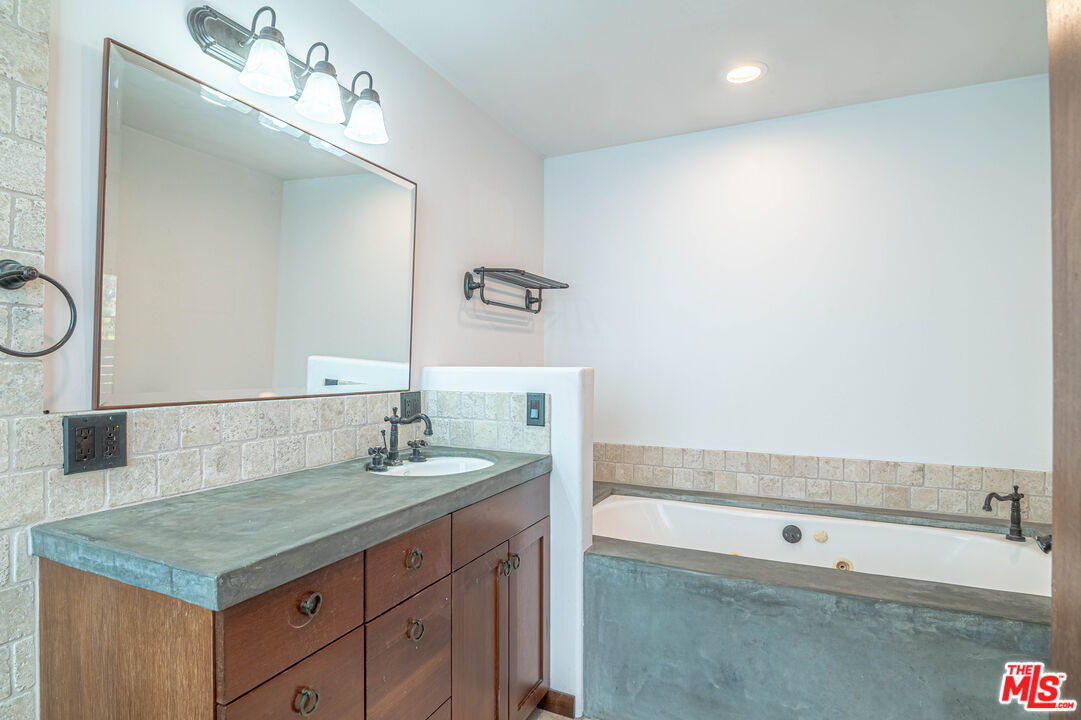 2504 Ocean Avenue Venice, CA 90291 - Photo 20 of 26 a bathroom with a sink and a mirror