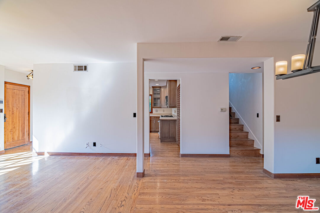 2504 Ocean Avenue Venice, CA 90291 - Photo 8 of 26 a view of a livingroom with wooden floor and stairs