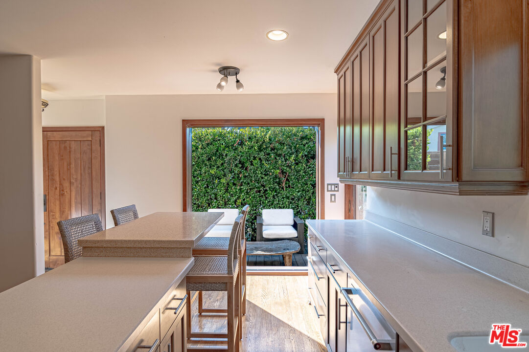 2504 Ocean Avenue Venice, CA 90291 - Photo 10 of 26 a view of a dining room with furniture large windows and wooden floor