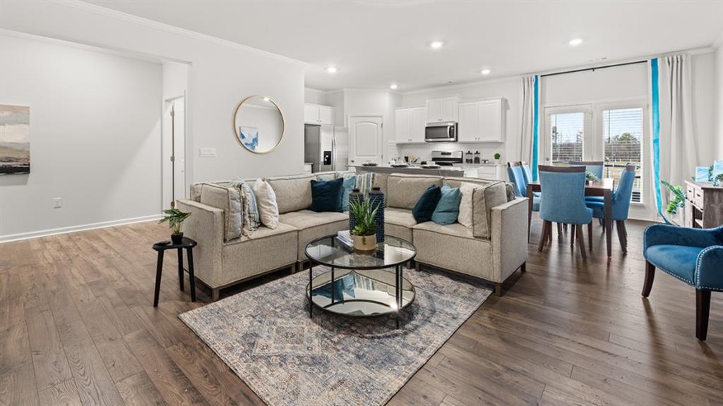 3269 Ryker Road Gainesville, GA 30507 - Photo 13 of 67 a living room with furniture wooden floor and a large window