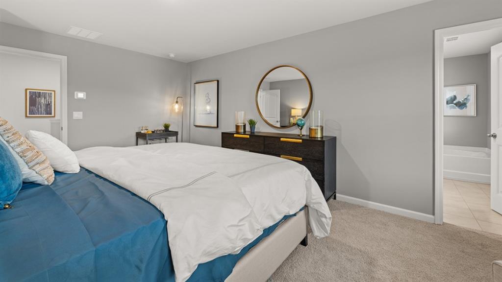 3269 Ryker Road Gainesville, GA 30507 - Photo 21 of 67 a bed sitting in a bedroom next to a window