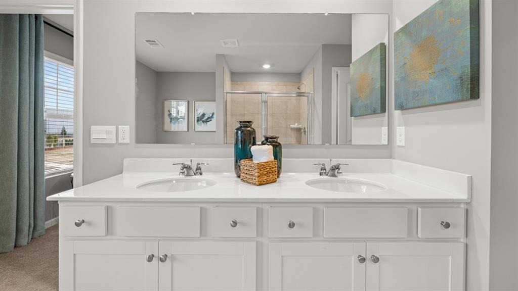3269 Ryker Road Gainesville, GA 30507 - Photo 25 of 67 a bathroom with a sink and a mirror