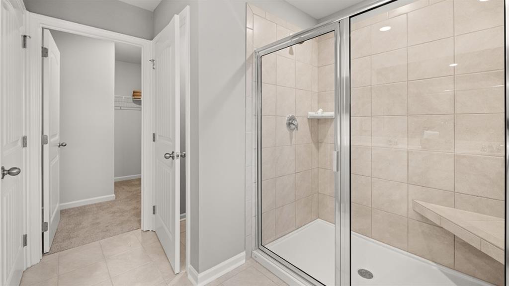 3269 Ryker Road Gainesville, GA 30507 - Photo 27 of 67 a bathroom with a shower and a glass door