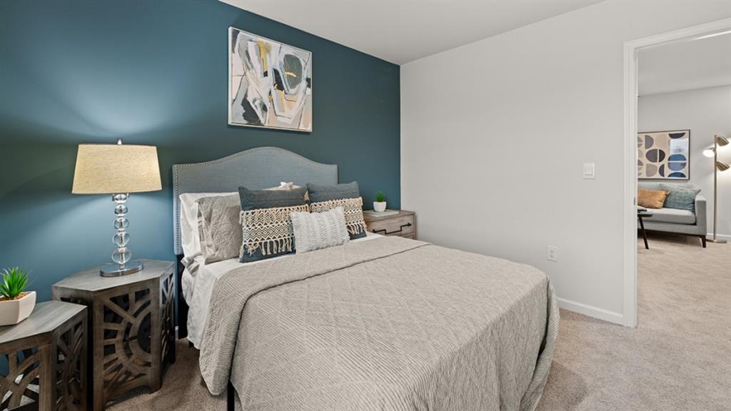 3269 Ryker Road Gainesville, GA 30507 - Photo 35 of 67 a bed room with a bed and a painting on the wall