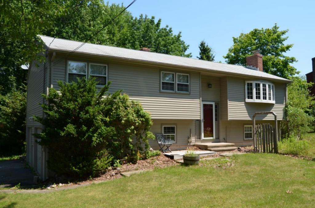 1464 Dunbar Hill Road Hamden, CT 06514 - Photo 1 of 1 a front view of a house with a yard