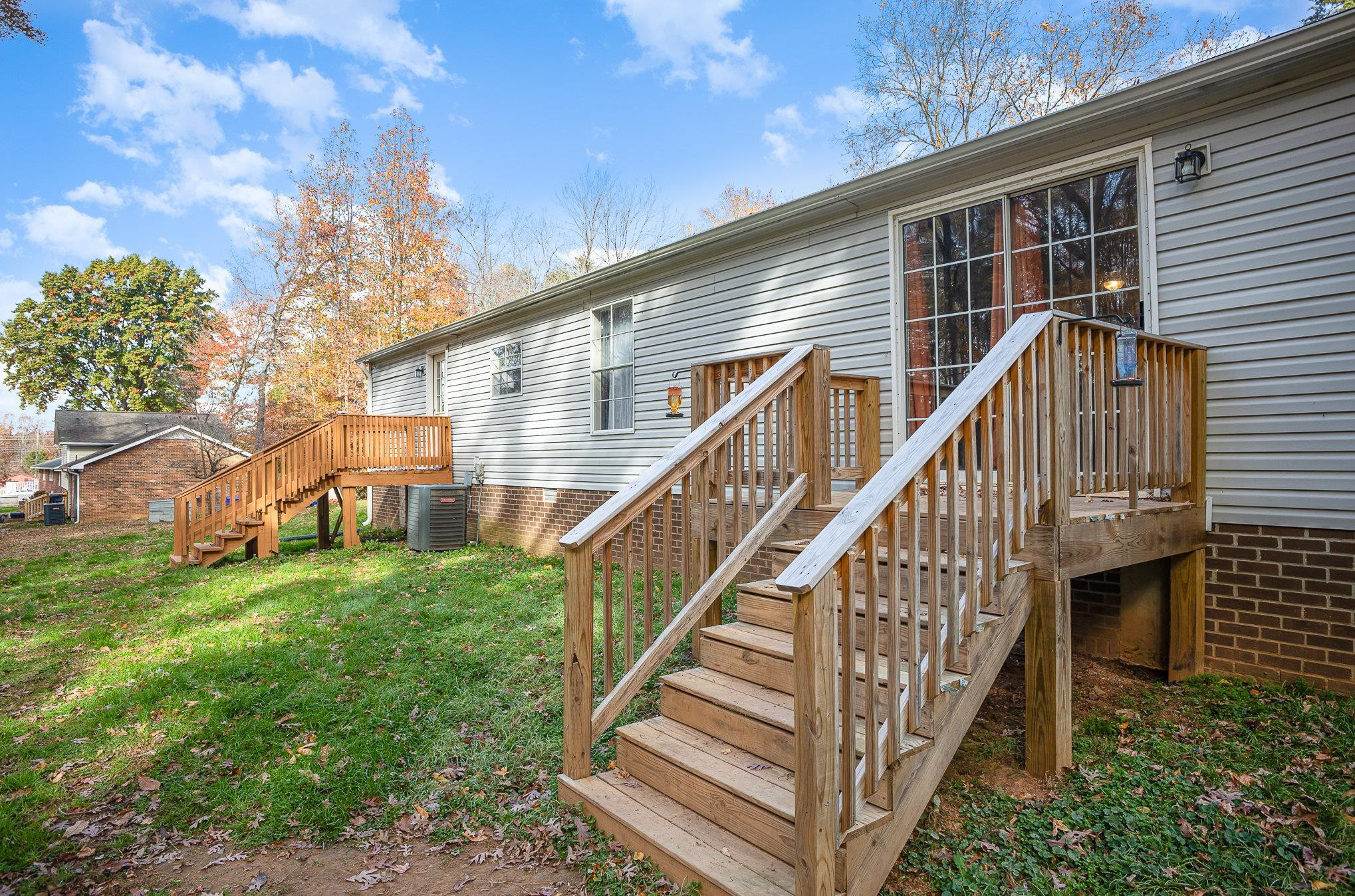 100 Barnette Tingen Road Roxboro, NC 27574 - Photo 20 of 27 a view of a house with wooden stairs and a fence