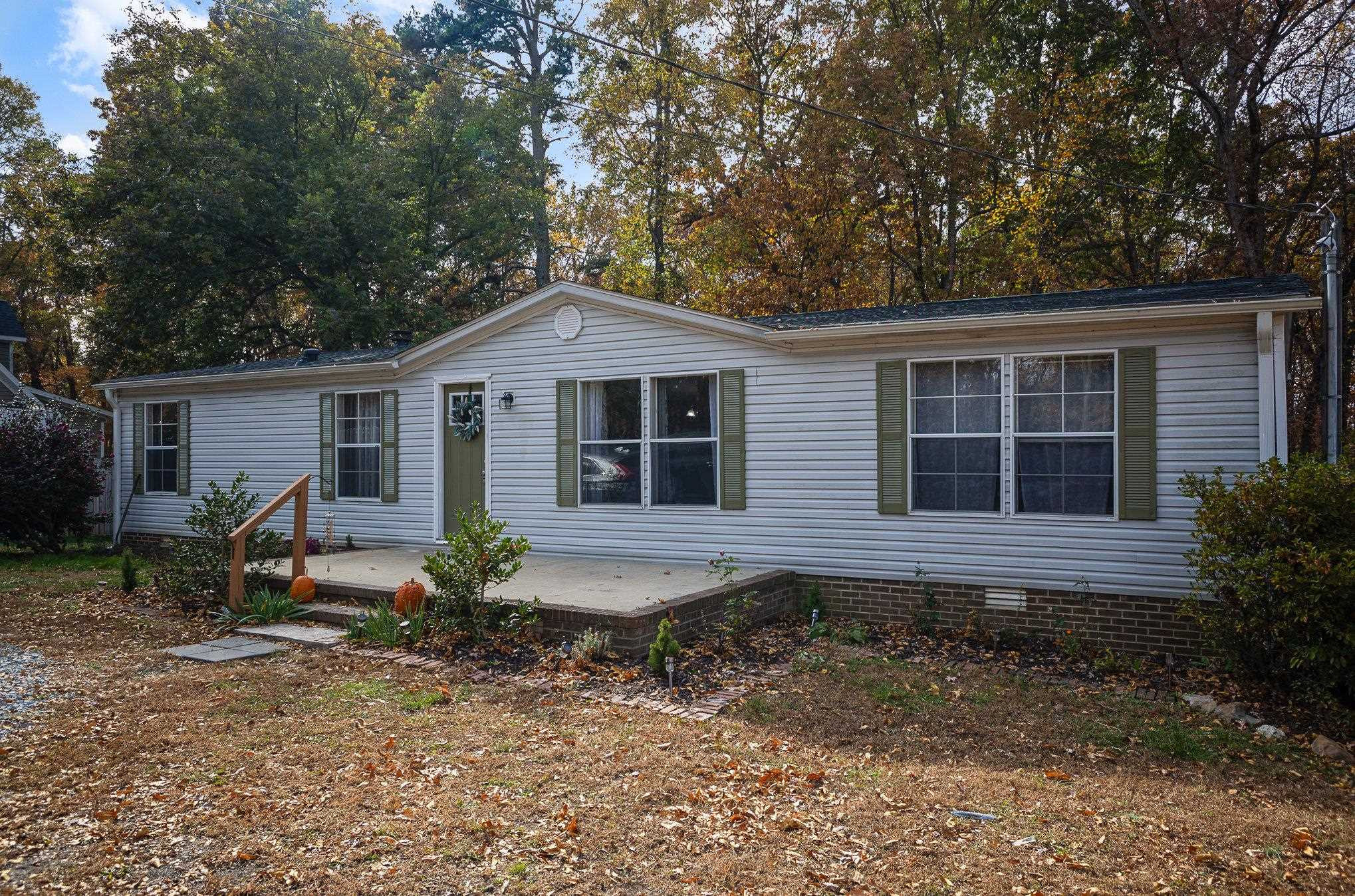 100 Barnette Tingen Road Roxboro, NC 27574 - Photo 2 of 27 a front view of a house with garden