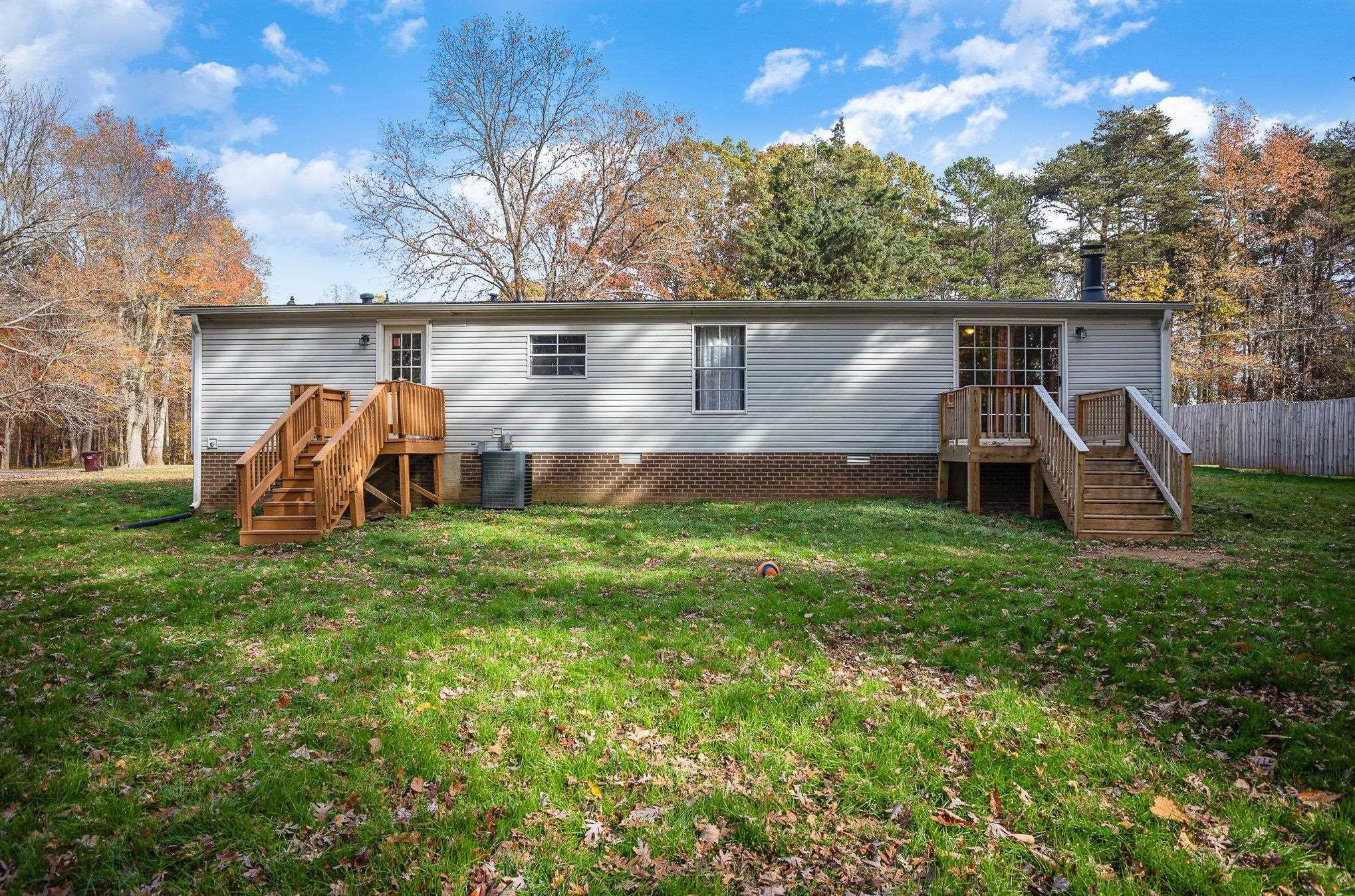 100 Barnette Tingen Road Roxboro, NC 27574 - Photo 21 of 27 a view of a house with a yard