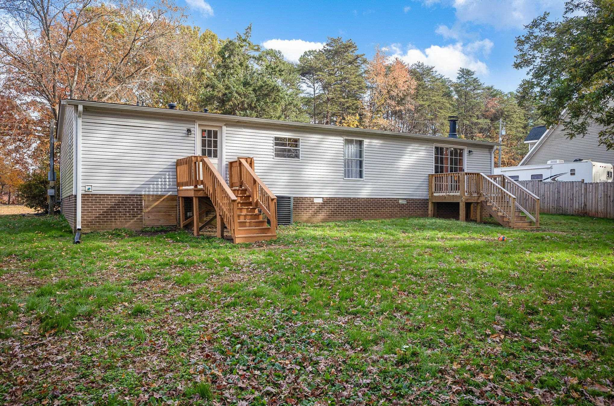 100 Barnette Tingen Road Roxboro, NC 27574 - Photo 22 of 27 a view of a house with backyard