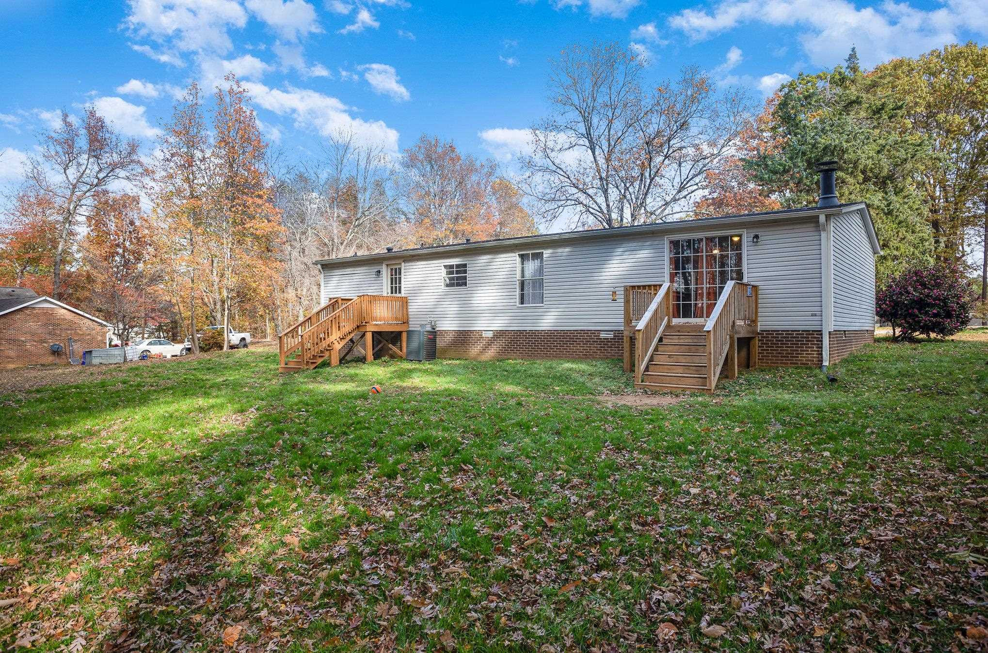 100 Barnette Tingen Road Roxboro, NC 27574 - Photo 23 of 27 a front view of a house with garden