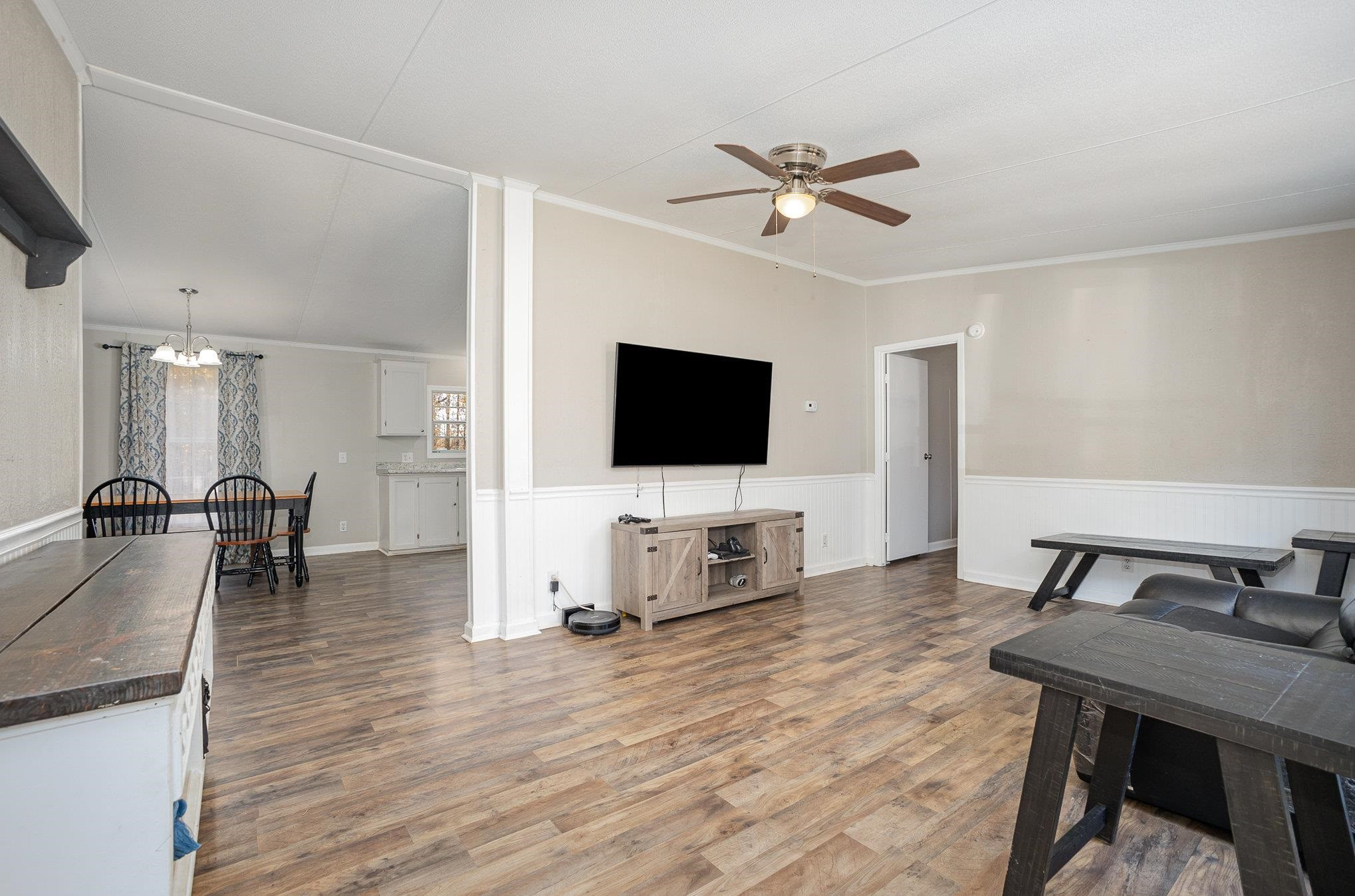 100 Barnette Tingen Road Roxboro, NC 27574 - Photo 3 of 27 a living room with furniture and a flat screen tv