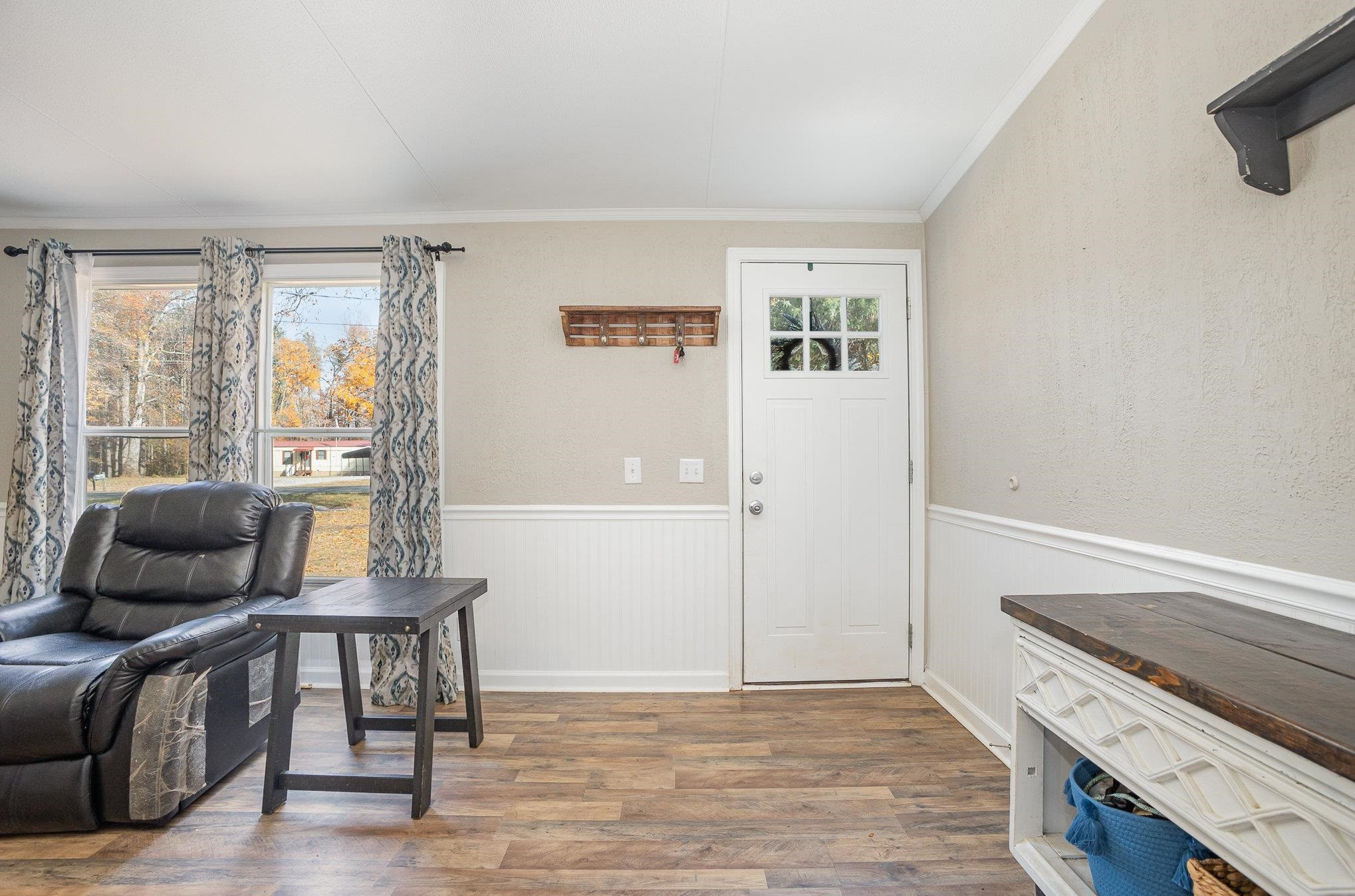 100 Barnette Tingen Road Roxboro, NC 27574 - Photo 5 of 27 a view of a livingroom with furniture and wooden floor