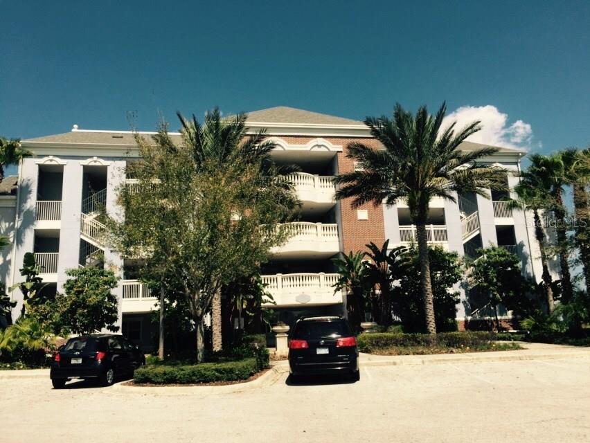 1100 Sunset View Circle, Unit 203 Reunion, FL 34747 - Photo 1 of 1 a car parked in front of a building