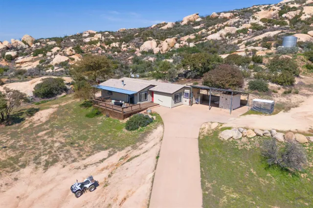 a aerial view of a house with a yard