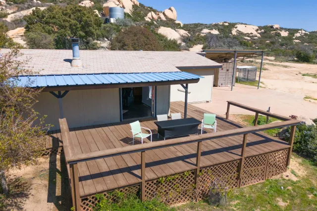 a view of a backyard of a house with a yard