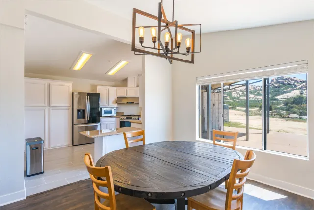 a living room with a large window and a table