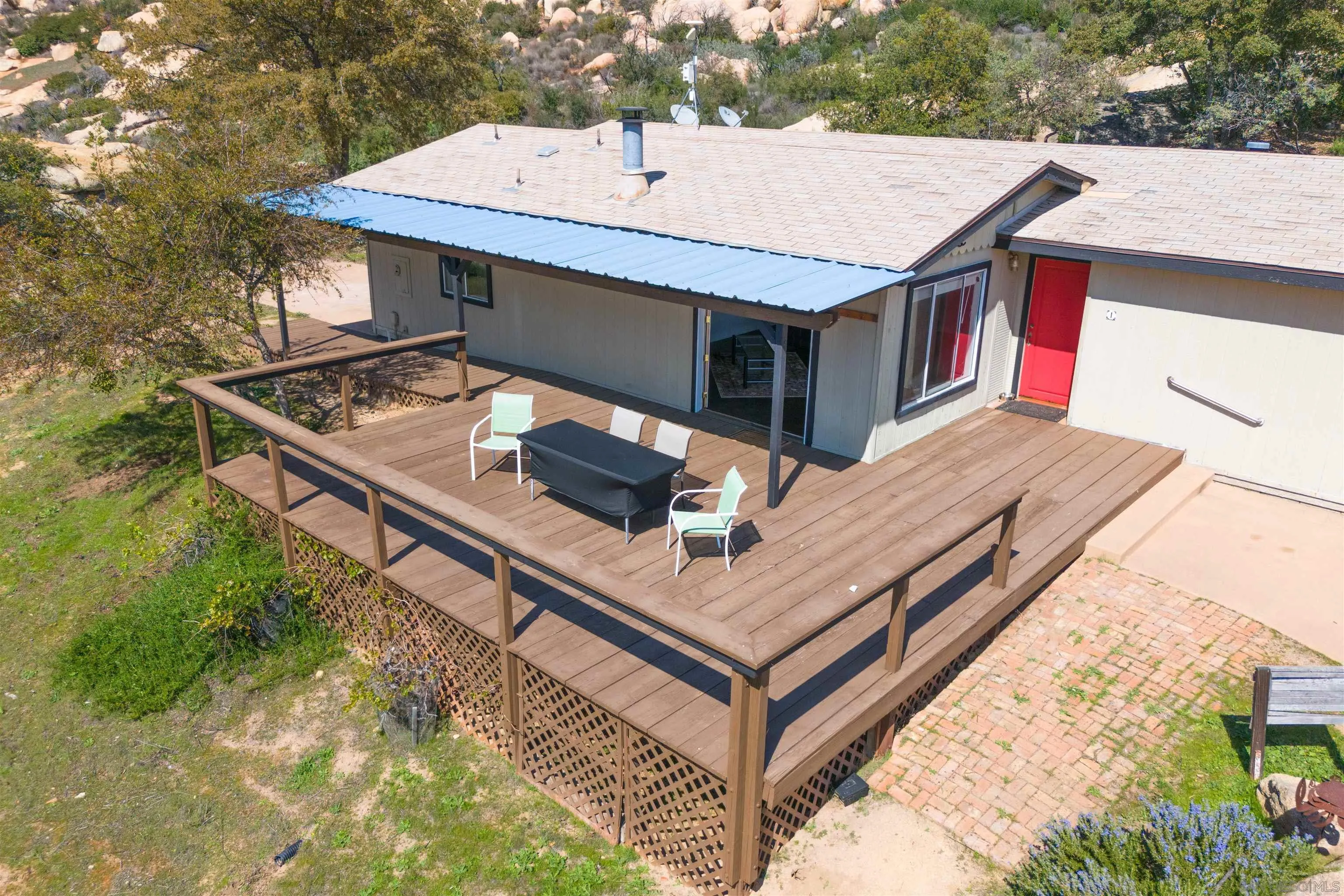 0 High Glen Road Alpine, CA 91901 - Photo 4 of 74 a roof deck with a table and chairs
