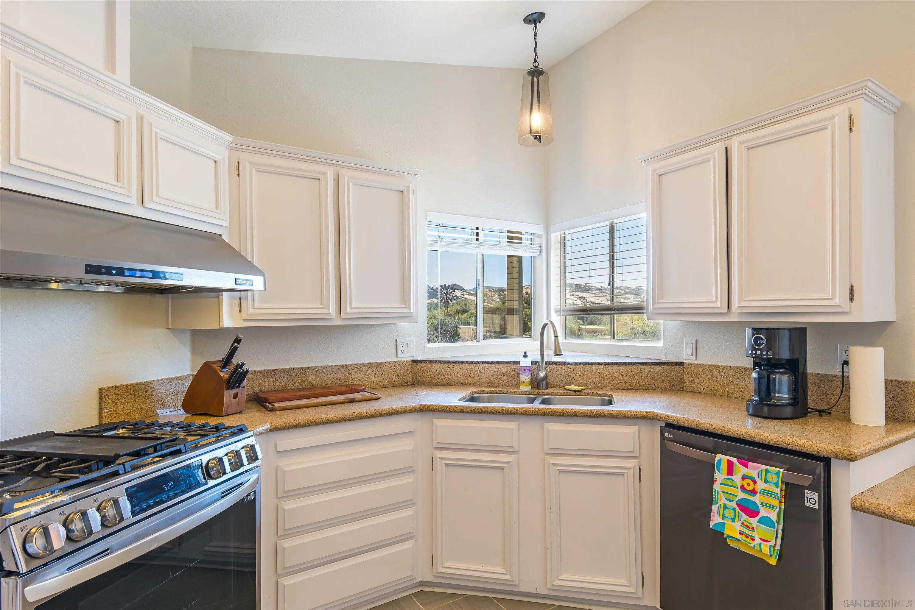 0 High Glen Road Alpine, CA 91901 - Photo 43 of 74 a kitchen with white cabinets and appliances