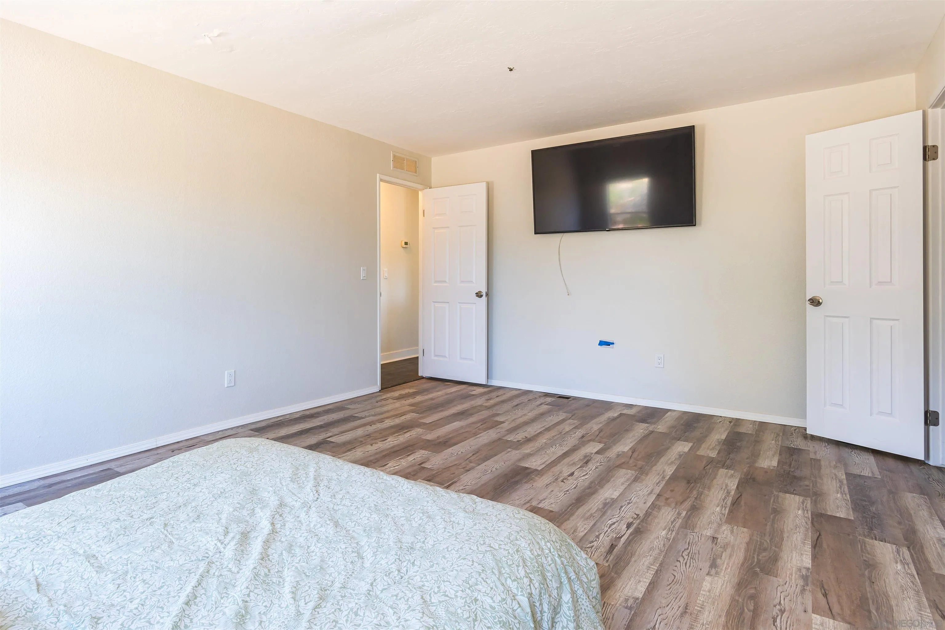 0 High Glen Road Alpine, CA 91901 - Photo 53 of 74 a bedroom with a bed and a flat screen tv