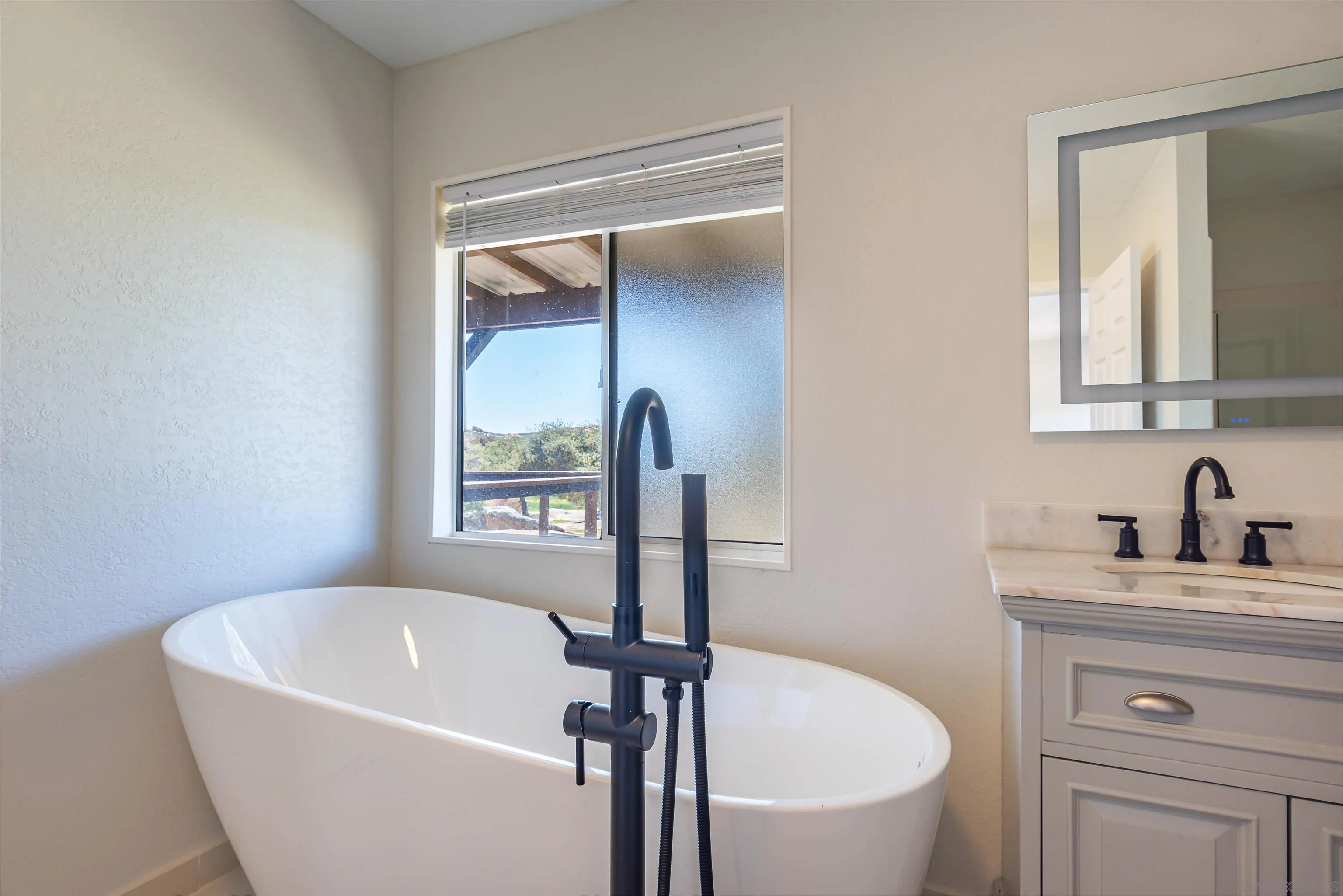 0 High Glen Road Alpine, CA 91901 - Photo 56 of 74 a white bath tub sitting next to a white sink
