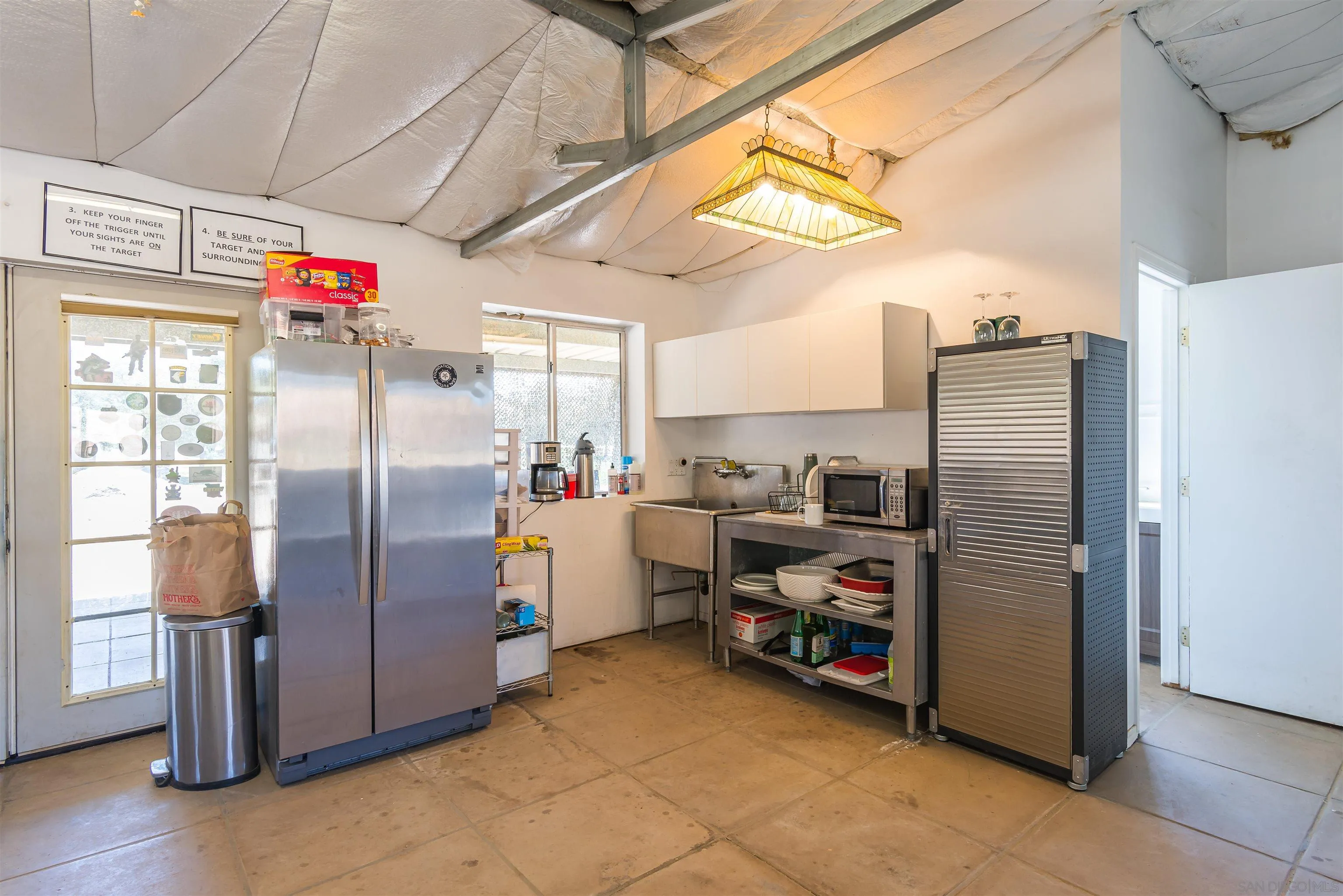 0 High Glen Road Alpine, CA 91901 - Photo 66 of 74 a utility room with stainless steel appliances a refrigerator and a window