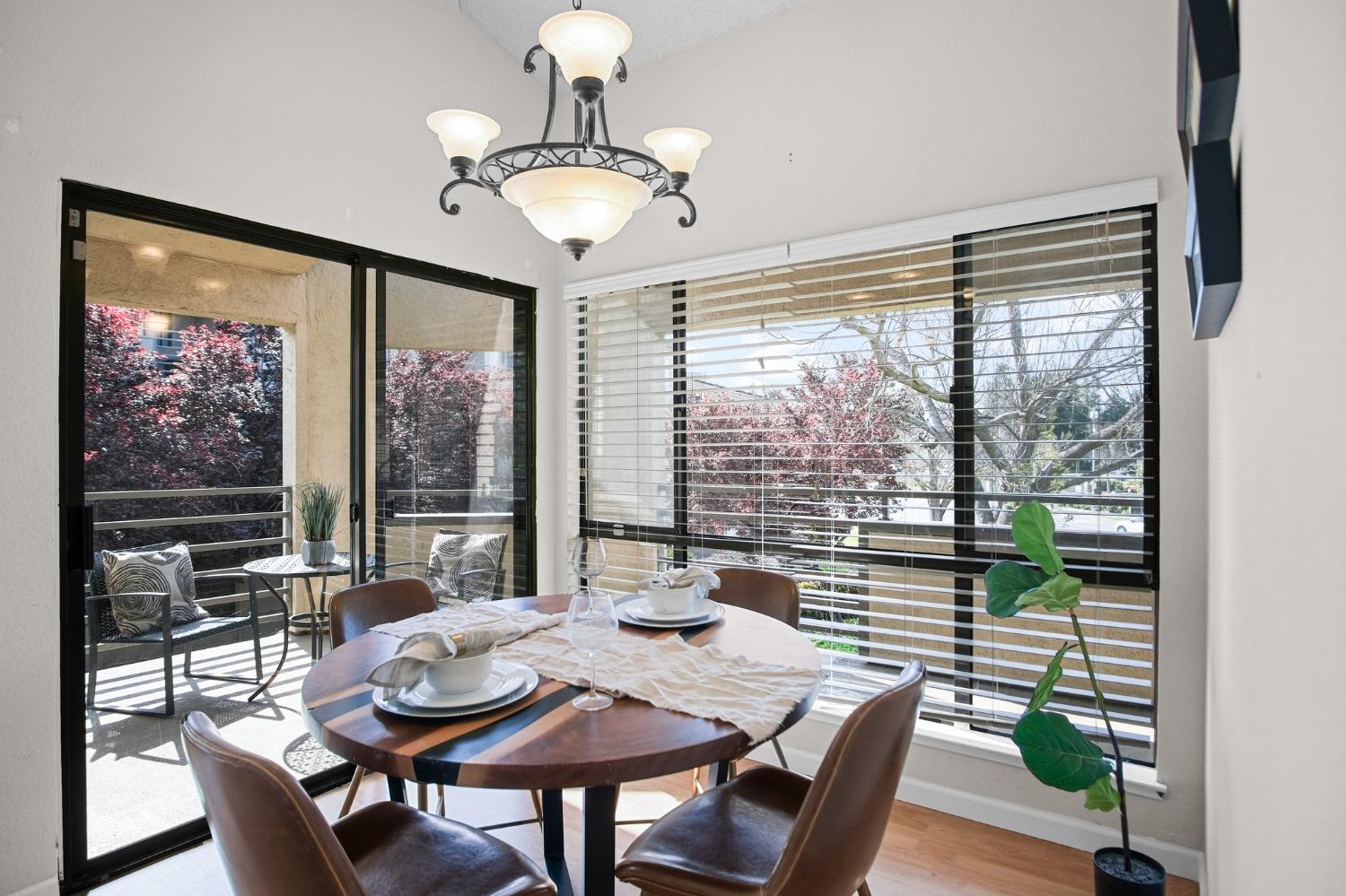 a view of a dining room with furniture window and outside view