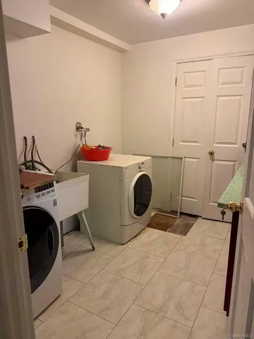 a room with a washing machine and washer